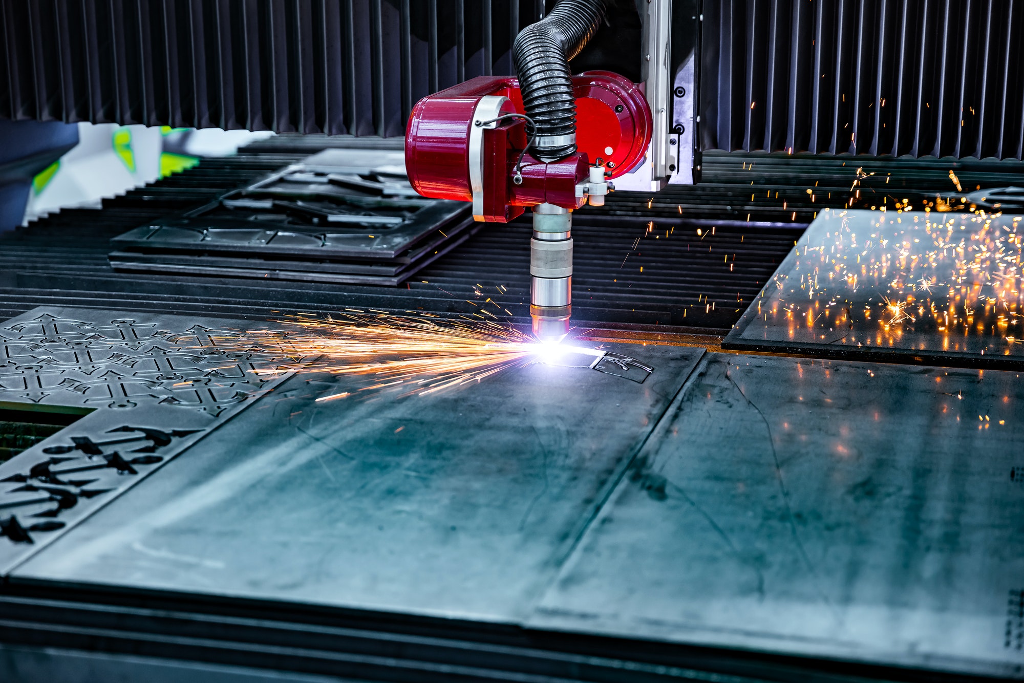 CNC Laser plasma cutting of metal, modern industrial technology.